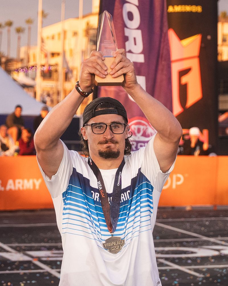 Justin Medeiros holding the Lazar Đukić MVP Award trophy at Wodapalooza SoCal 2025
